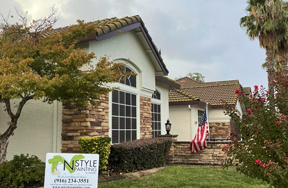 man-painting-house-exterior 1